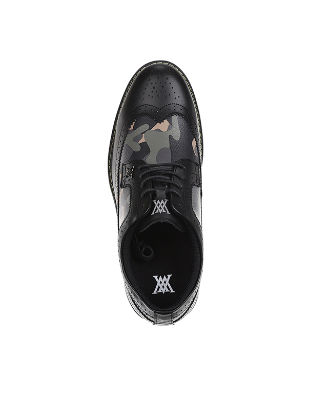 Men's black camo wingtip brogue shoes featuring natural cowhide leather and synthetic leather accents, showcasing a stylish design.