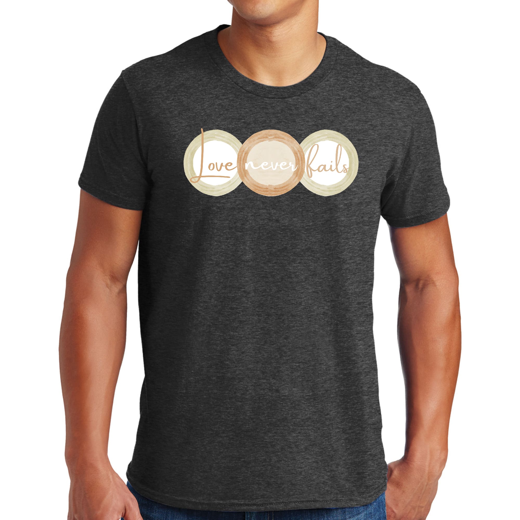 Mens Graphic T-shirt featuring 'Love Never Fails' design in pastel brown, beige, and green circular shapes, made from soft preshrunk cotton.