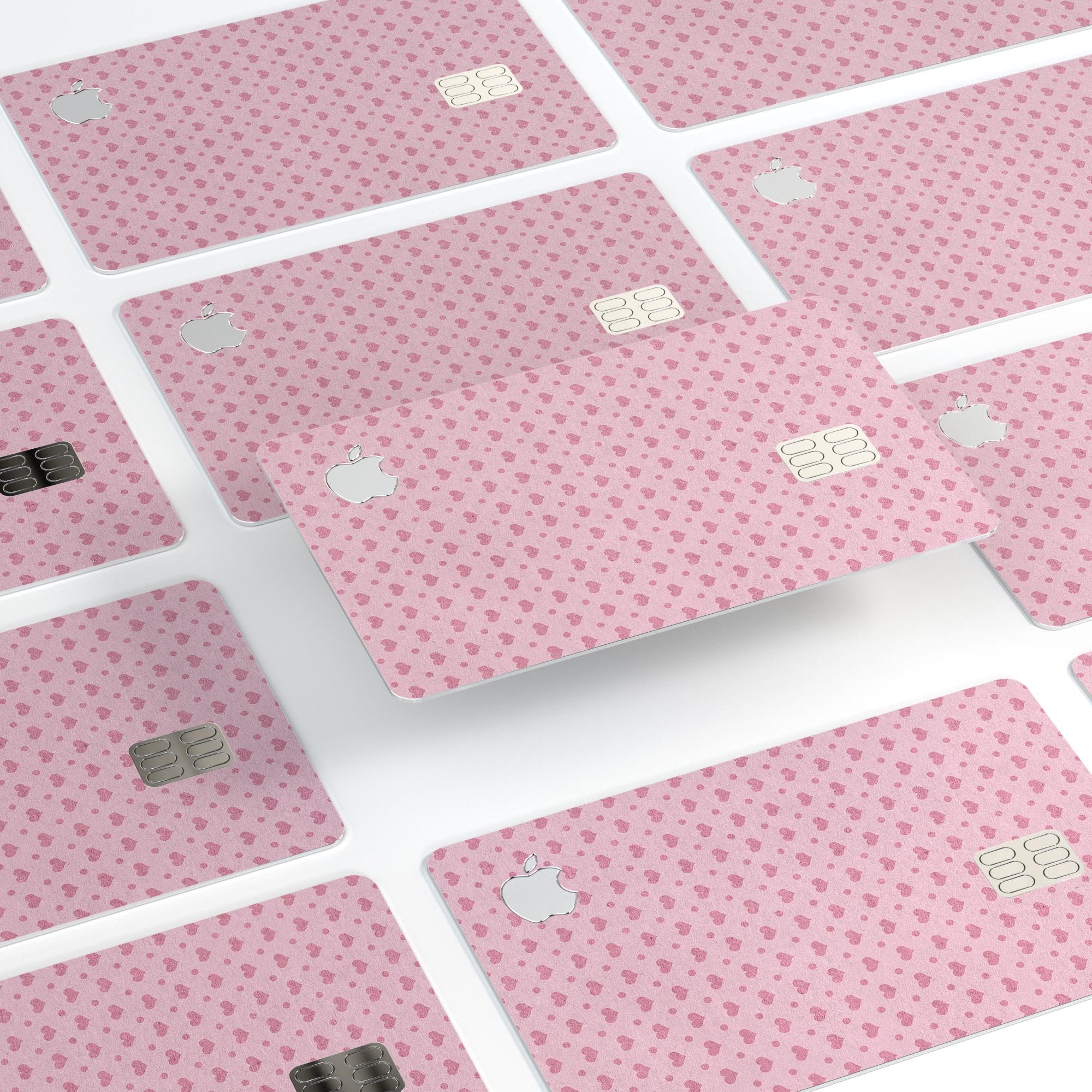 Micro Pink Hearts decal skin for Apple Card, featuring a pale pink background and vibrant heart design.