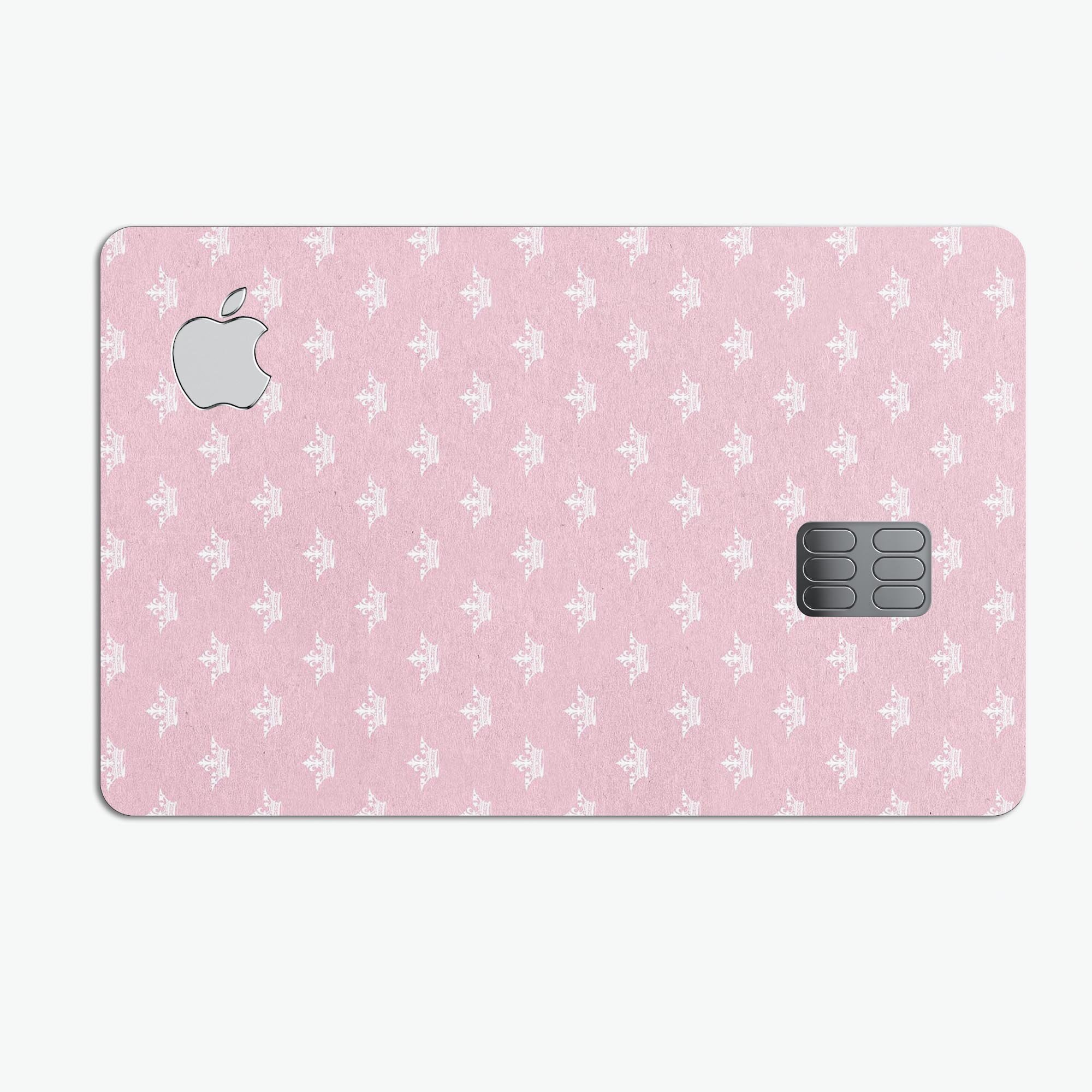 Micro White Crowns Over Pink decal skin-kit for Apple Card, showcasing premium vinyl design and protective features.