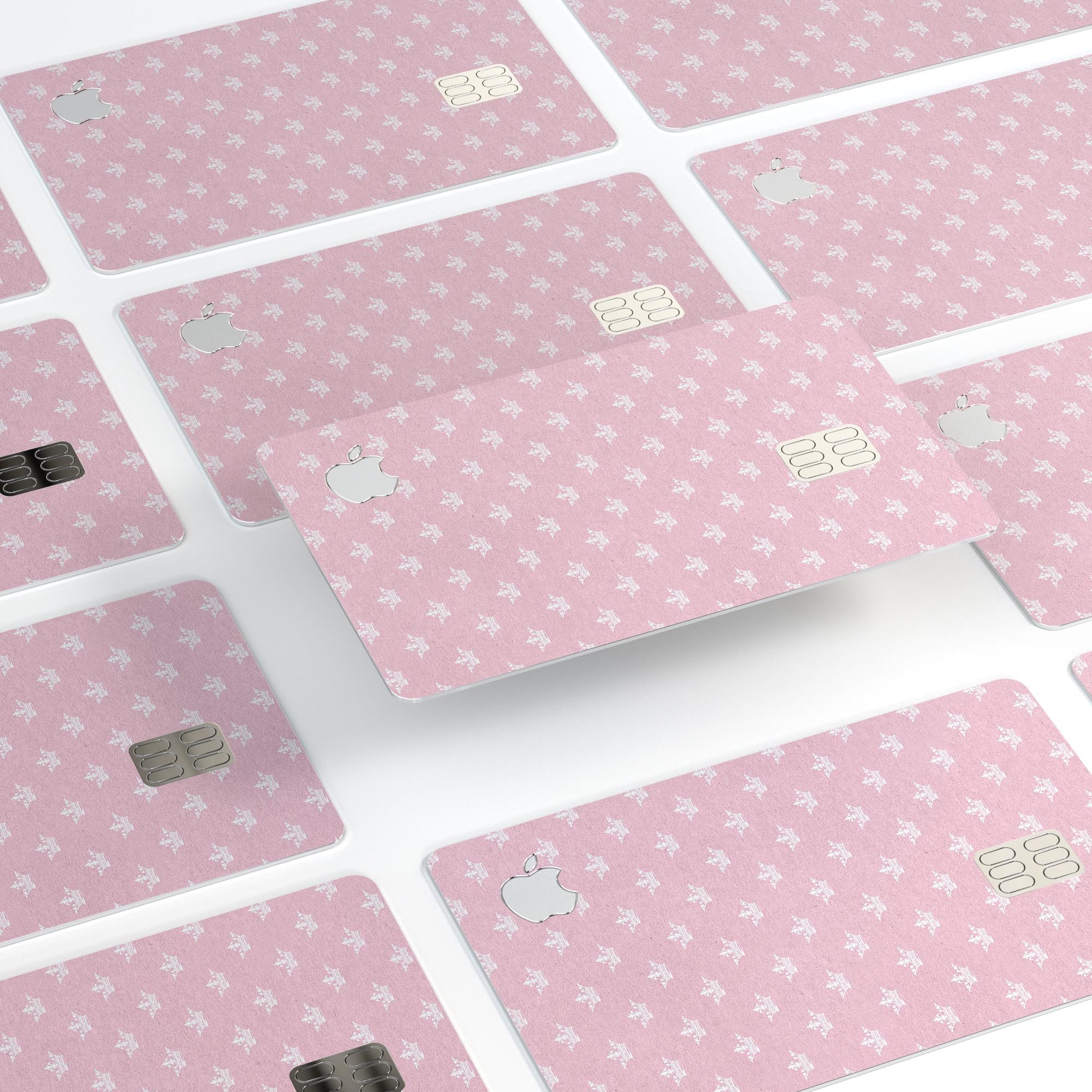 Micro White Crowns Over Pink decal skin-kit for Apple Card, showcasing premium vinyl design and protective features.