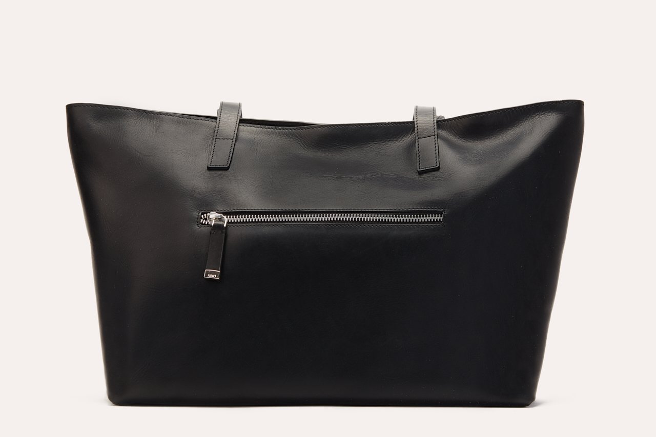 Mid Zip Tote made of genuine leather with a top zip closure, featuring an internal zipper pocket and two small sleeves for organization.