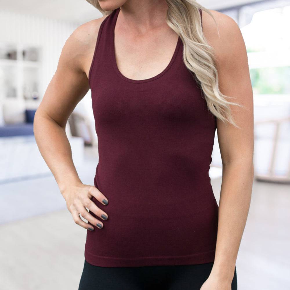 Mid-Length Racerback Tank in ribbed fabric, showcasing scoop neckline and racerback design, available in various colors.