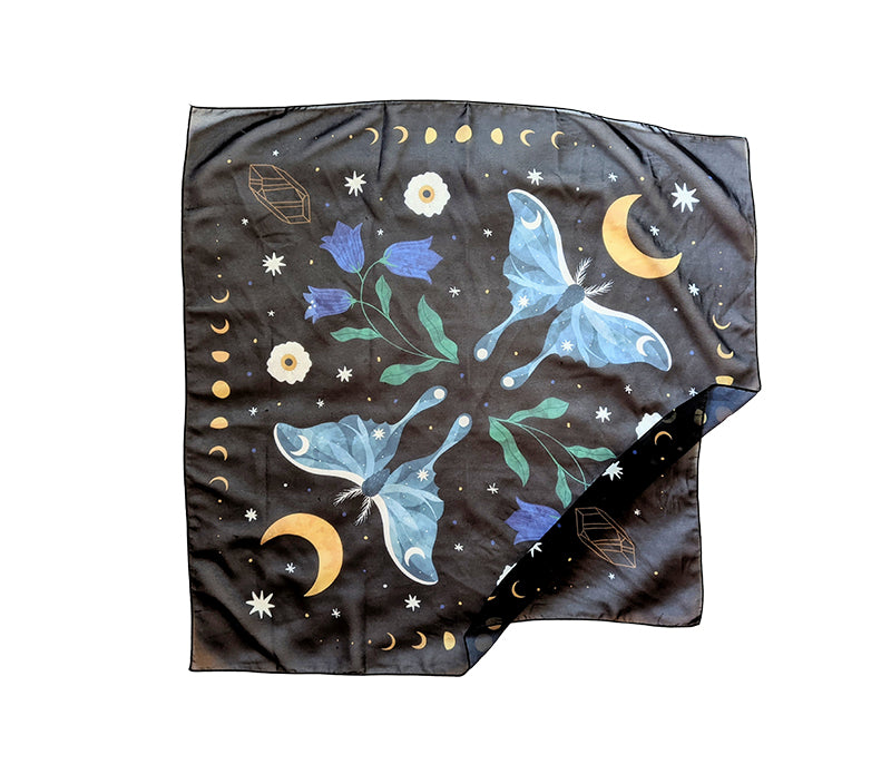 A beautifully designed Midnight Garden Scarf featuring a mystical night theme, made from 100% recycled vegan silk, perfect for various styling options.