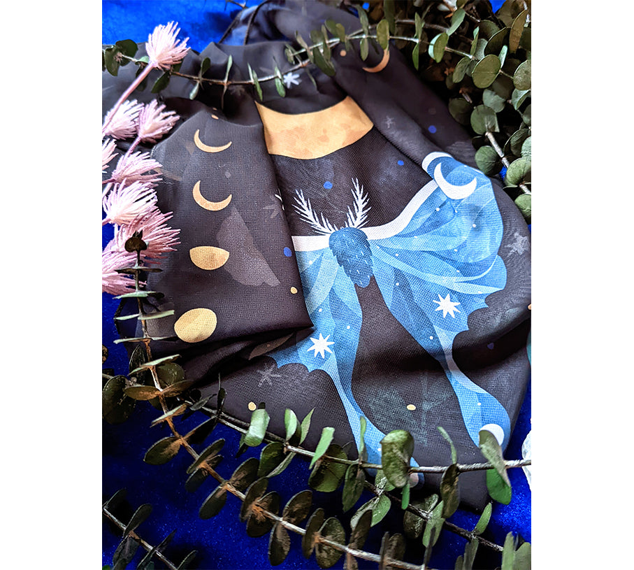 A beautifully designed Midnight Garden Scarf featuring a mystical night theme, made from 100% recycled vegan silk, perfect for various styling options.