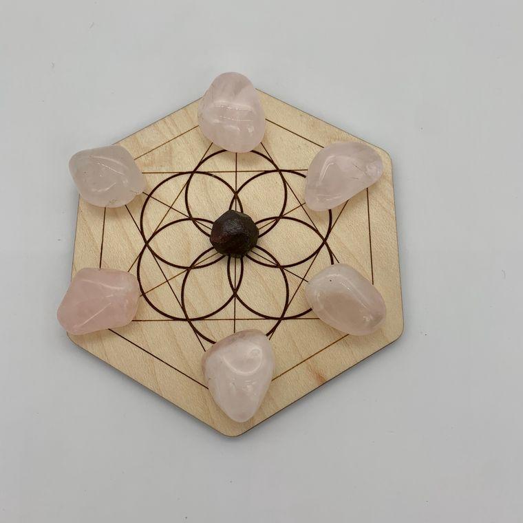 Mini Crystal Love Grid made of maple wood with six rose quartz stones and one garnet, designed to amplify love intentions.