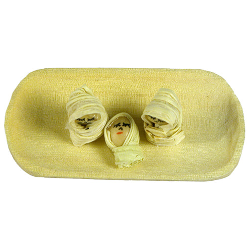 Miniature Balsa Wood Nativity featuring Mary, Joseph, and Baby Jesus crafted from corn husk and beans on a carved balsa wood base.