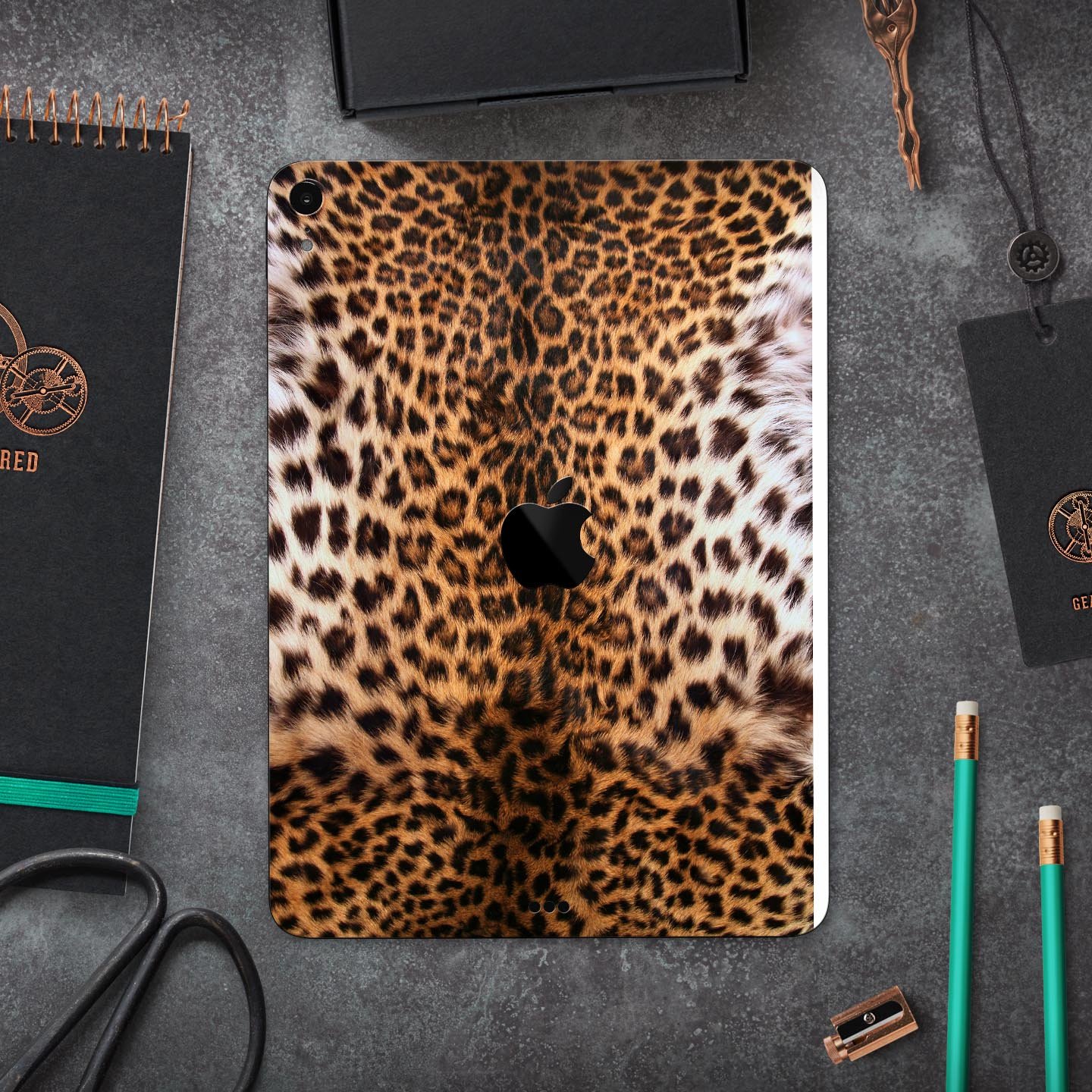 Mirrored Leopard Hide skin decal for Apple iPad Pro, showcasing a stylish leopard print design with a glossy finish.