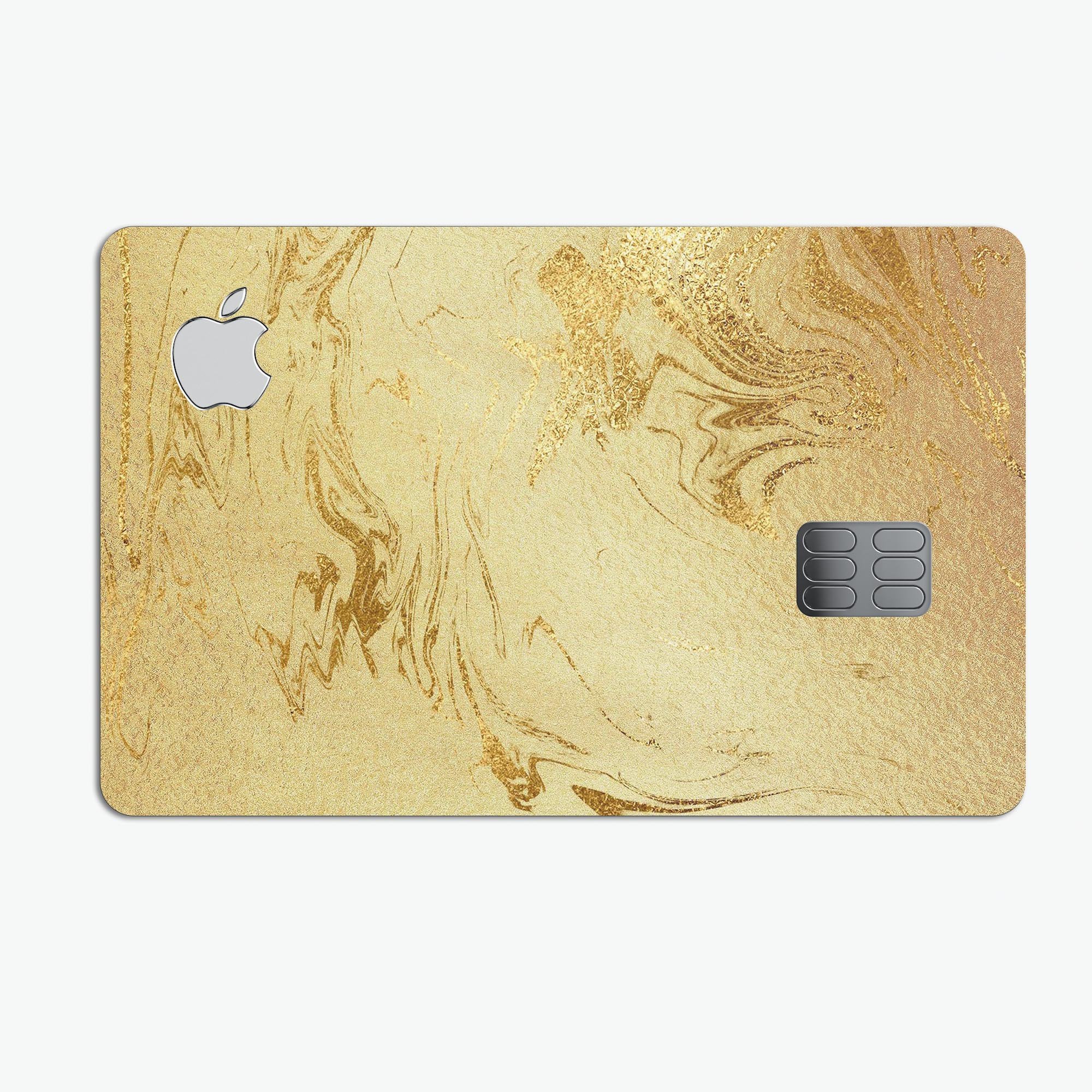 Molten Gold Digital Foil Swirl V10 skin applied on an Apple Card, showcasing its premium design and protective features.