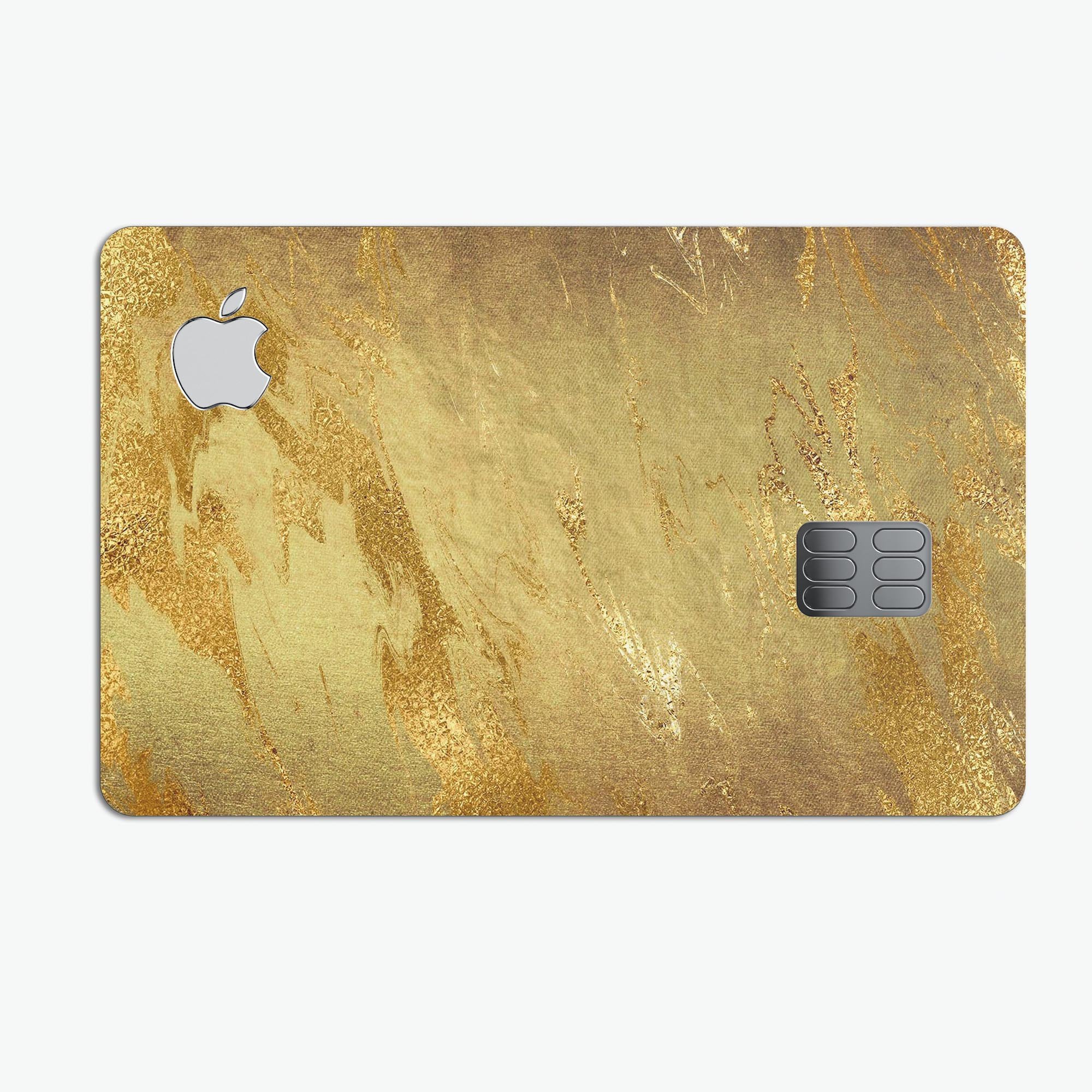 Molten Gold Digital Foil Swirl V6 skin applied to an Apple Card, showcasing its premium design and protective features.