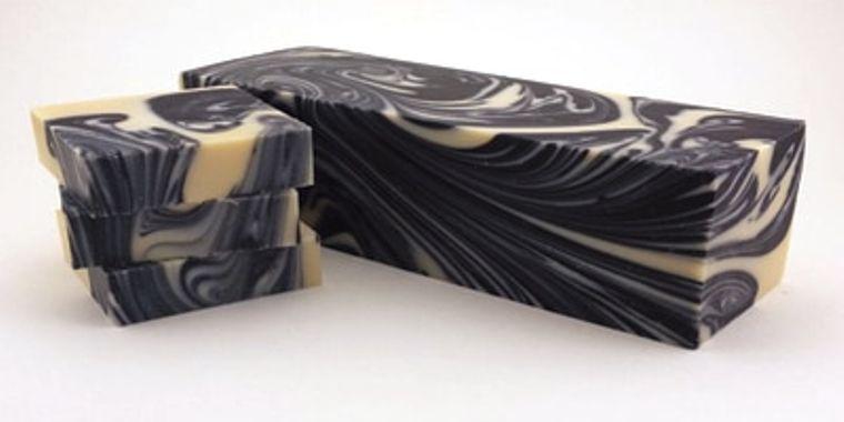 Moon Magick Soap with deep musk and floral notes, featuring activated charcoal and unique handmade design.