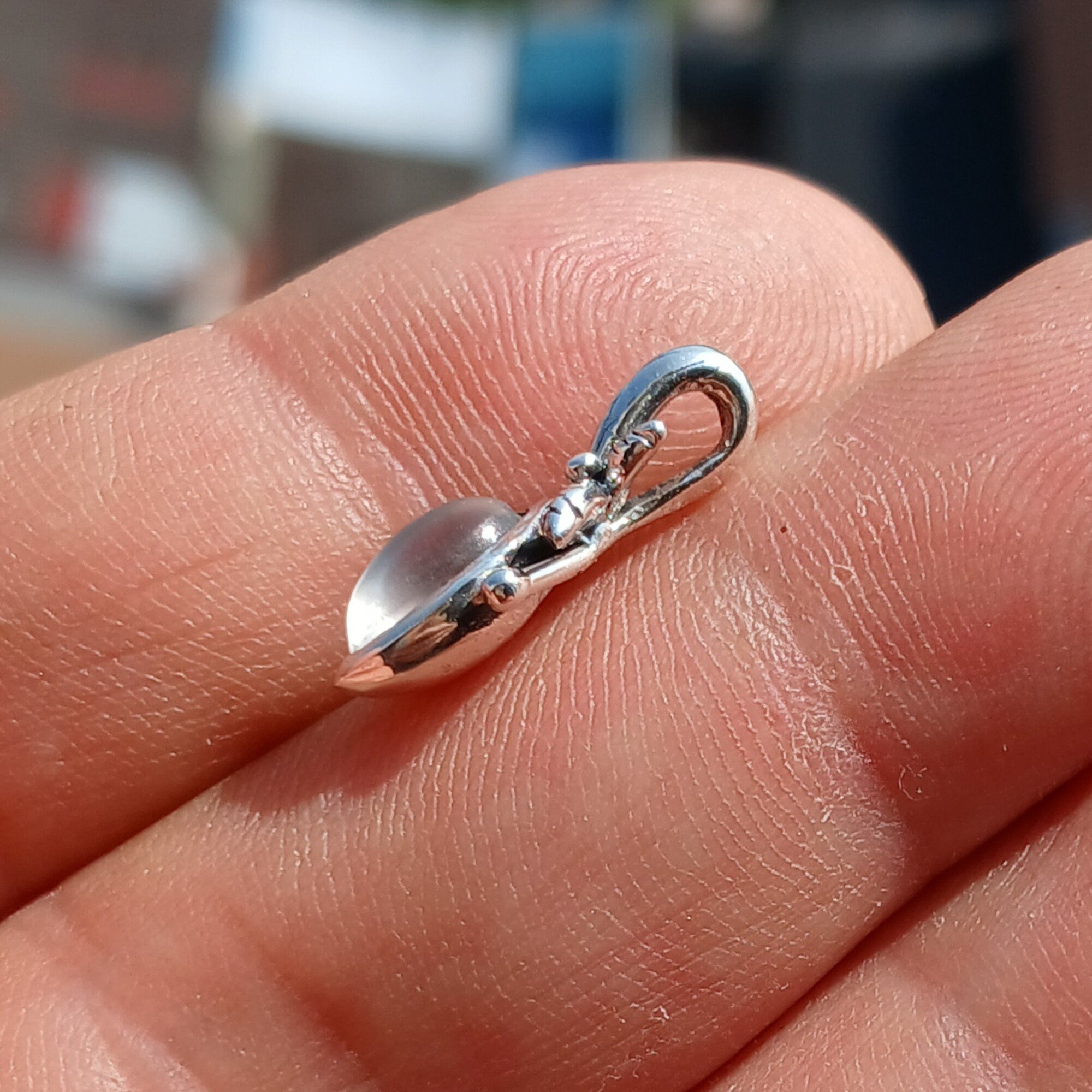 A beautiful Moonstone Pendant crafted in sterling silver, featuring a marquise-shaped Ceylon Moonstone with a delicate leaf design.