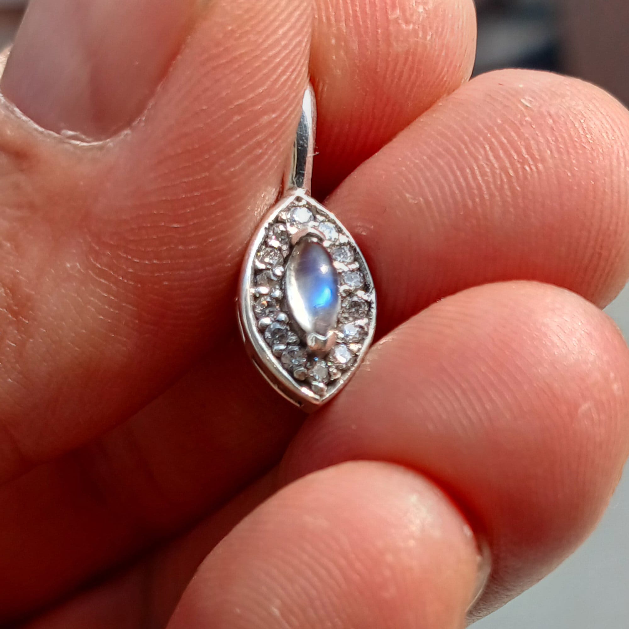 A beautiful Moonstone Pendant crafted in sterling silver, featuring a Ceylon Moonstone and sparkling CZ stones, showcasing elegance and charm.