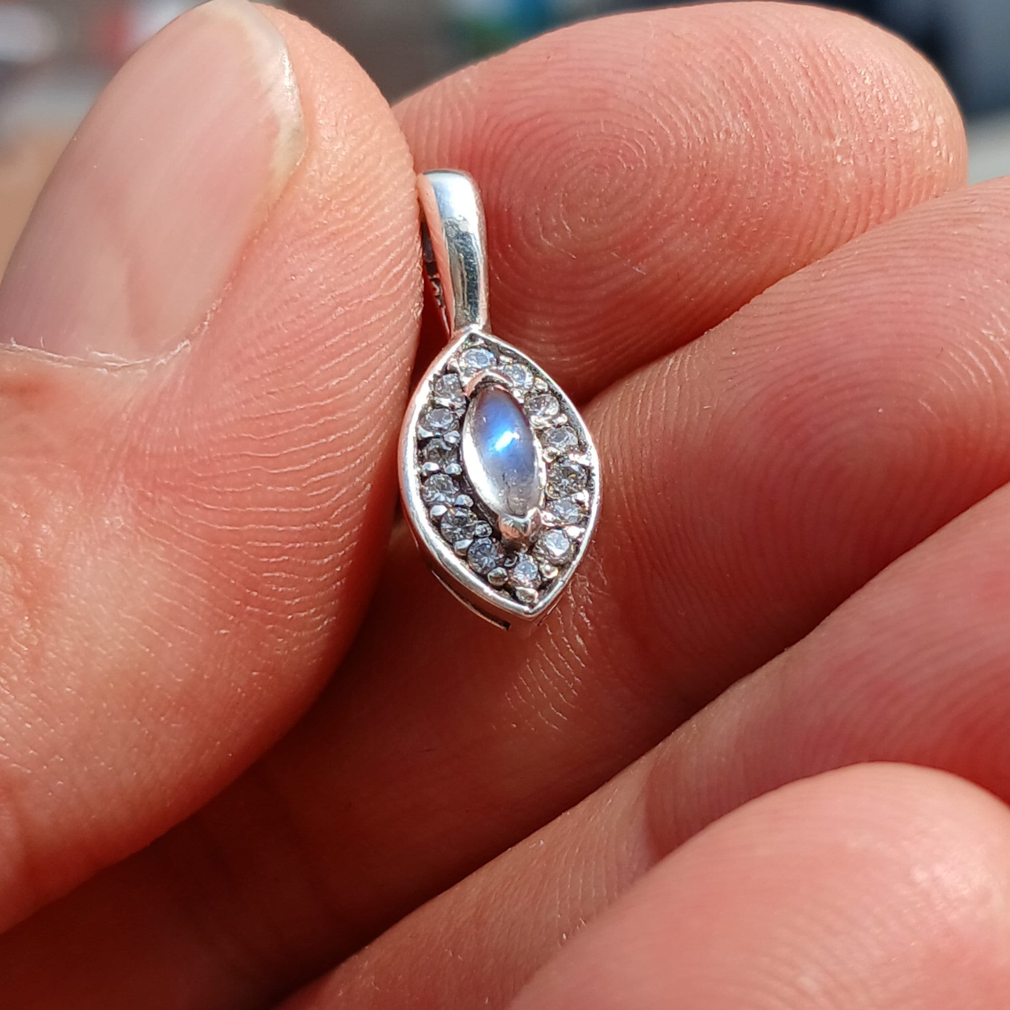 A beautiful Moonstone Pendant crafted in sterling silver, featuring a Ceylon Moonstone and sparkling CZ stones, showcasing elegance and charm.