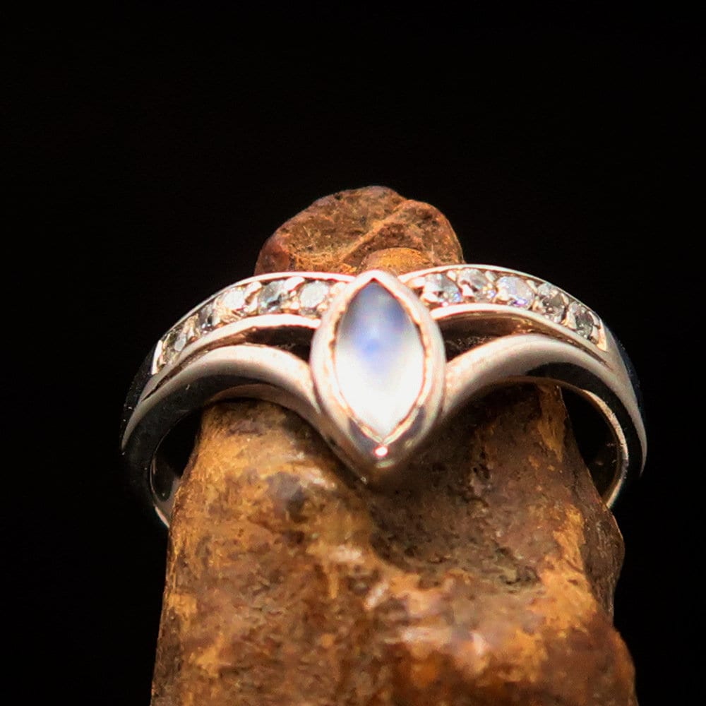 Elegant Moonstone Silver Ring featuring a marquise-shaped moonstone and sparkling CZ stones, set in polished Sterling Silver.