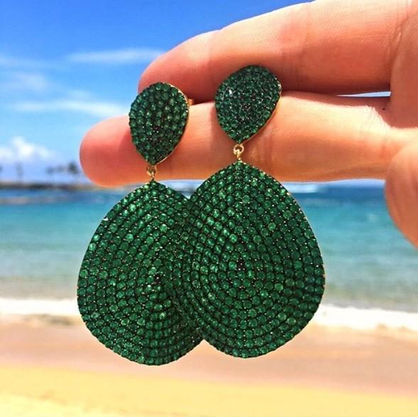 Monte Carlo Earrings featuring gold and emerald zircon, showcasing elegant organic shield design with sparkling details.