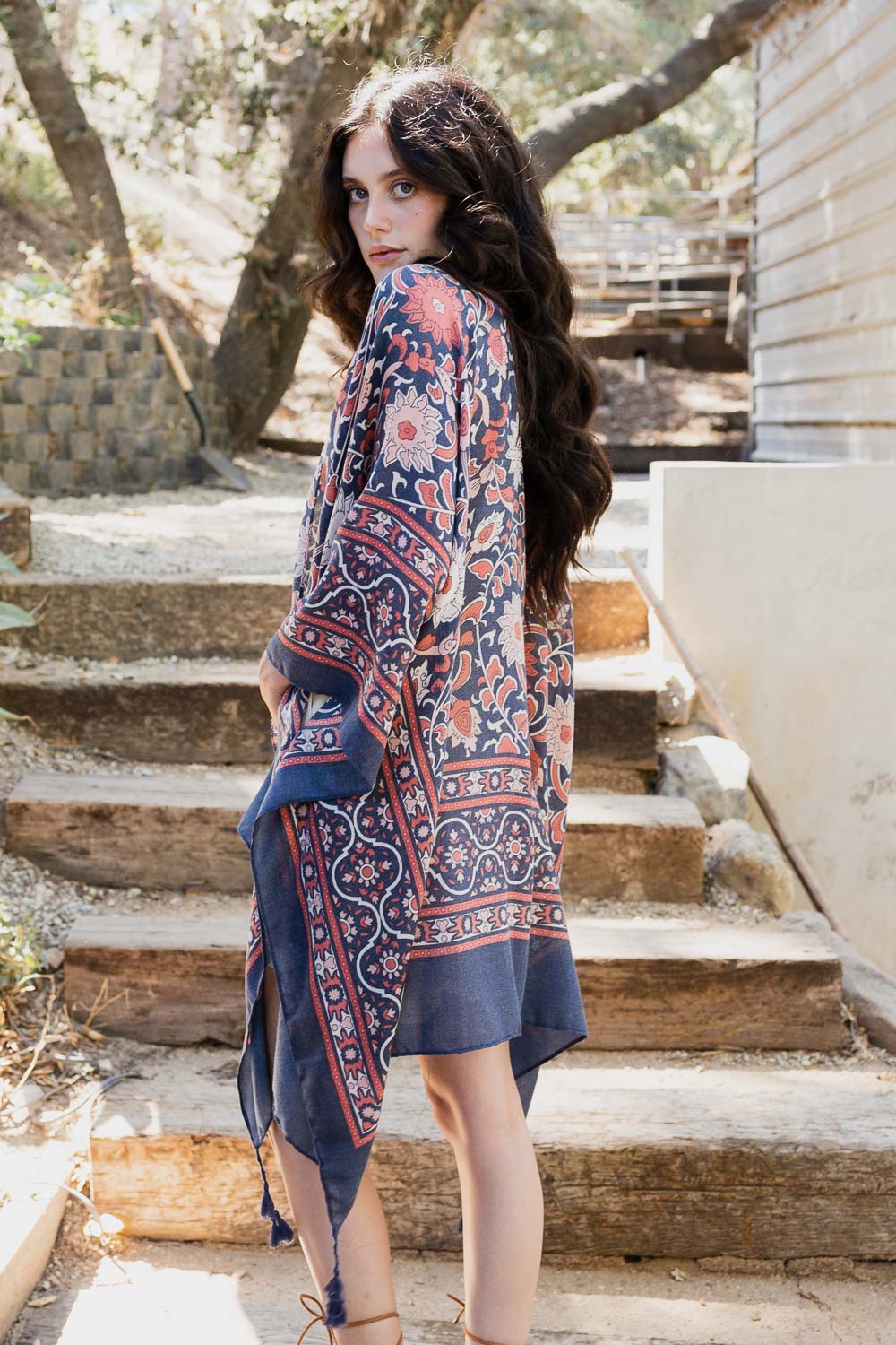 A stylish Moroccan Inspired Tapestry Kimono featuring vibrant colors and intricate patterns, perfect for layering over outfits.