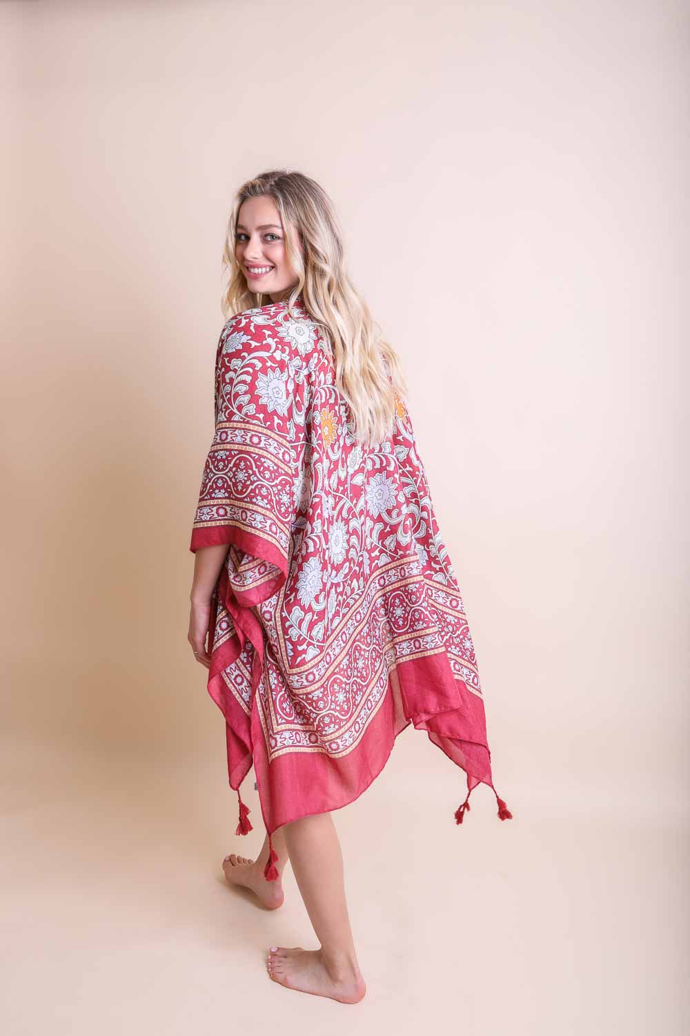 A stylish Moroccan Inspired Tapestry Kimono featuring vibrant colors and intricate patterns, perfect for layering over outfits.