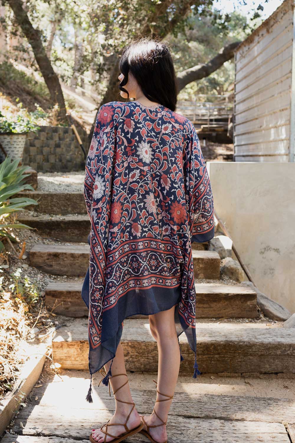 A stylish Moroccan Inspired Tapestry Kimono featuring vibrant colors and intricate patterns, perfect for layering over outfits.