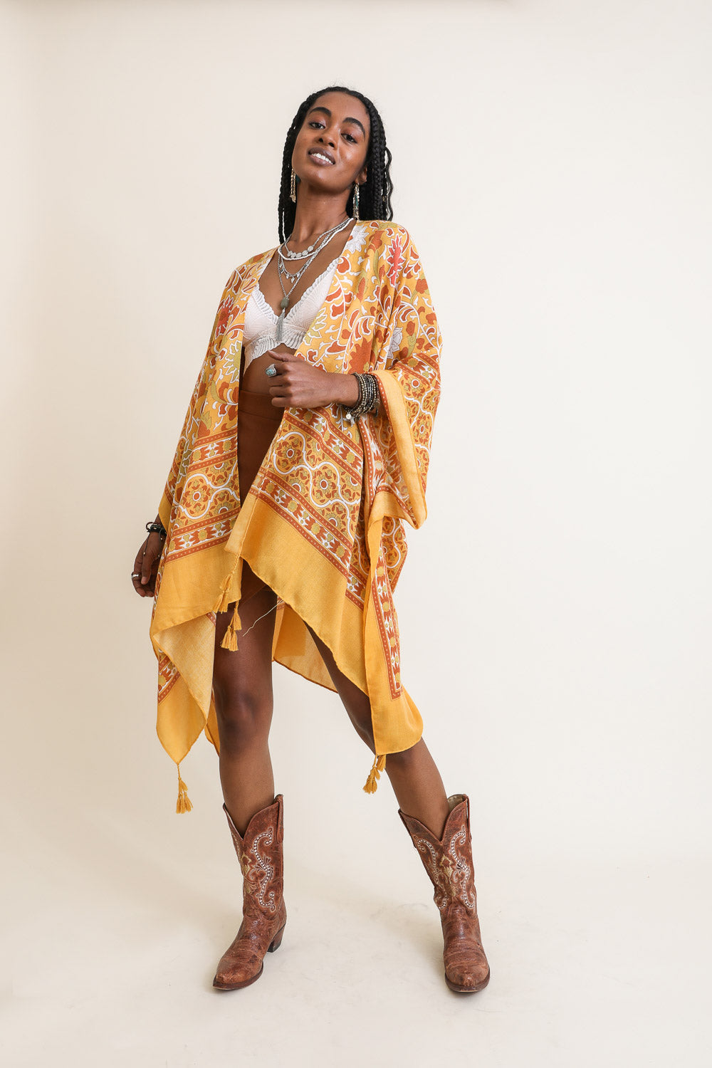 A stylish Moroccan Touch Tapestry Kimono featuring intricate tapestry patterns in vibrant colors, perfect for layering over outfits.