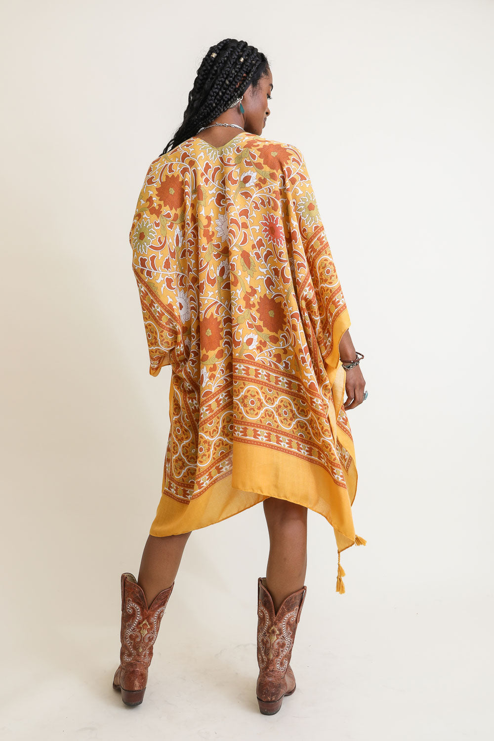 A stylish Moroccan Touch Tapestry Kimono featuring intricate tapestry patterns in vibrant colors, perfect for layering over outfits.