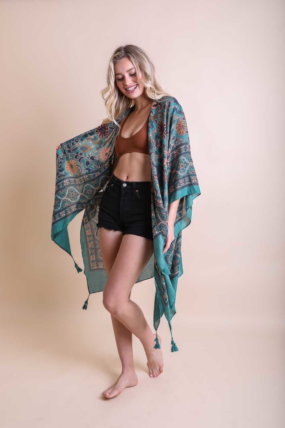 A stylish Moroccan Touch Tapestry Kimono featuring intricate tapestry patterns in vibrant colors, perfect for layering over outfits.