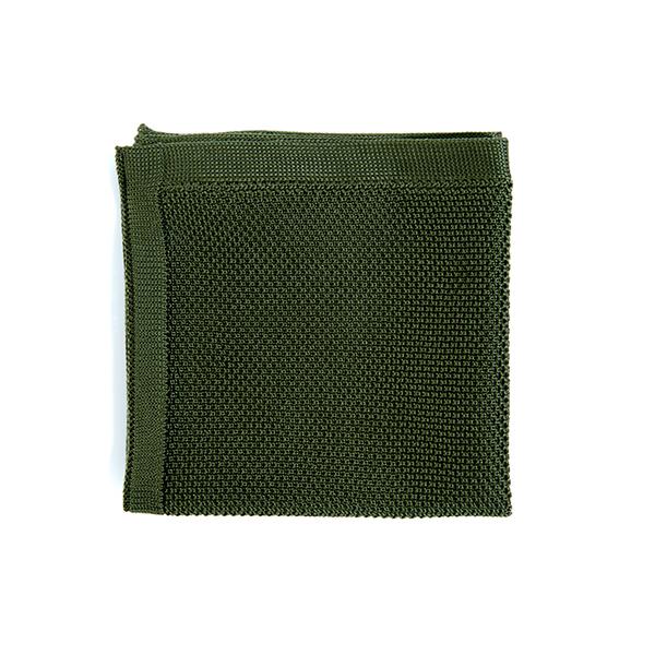 Moss green knitted pocket square displayed elegantly, showcasing its texture and color.