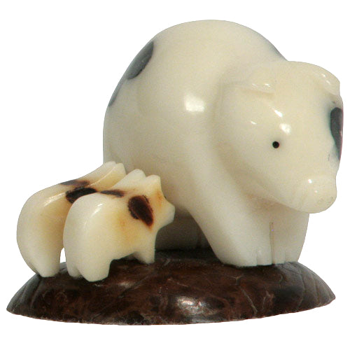 Hand-carved Mother Pig with Piglets figurine made from tagua nuts, showcasing intricate details and natural colors.