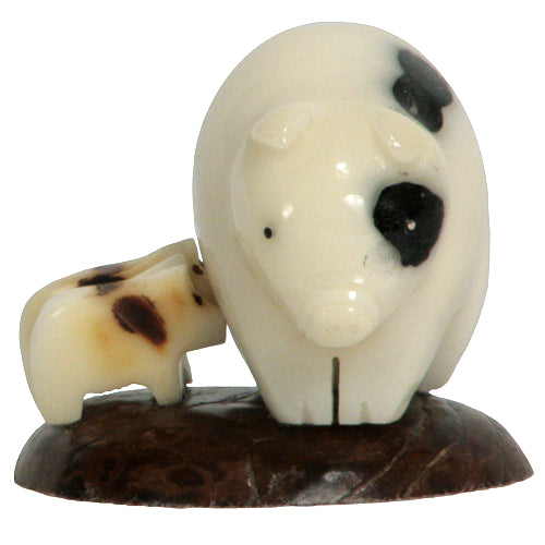 Hand-carved Mother Pig with Piglets figurine made from tagua nuts, showcasing intricate details and natural colors.