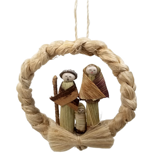 Hand-woven Nativity Wreath Ornament featuring Mary, Joseph, and Baby figures made from corn husk and beans, crafted from natural Cabuya fiber.