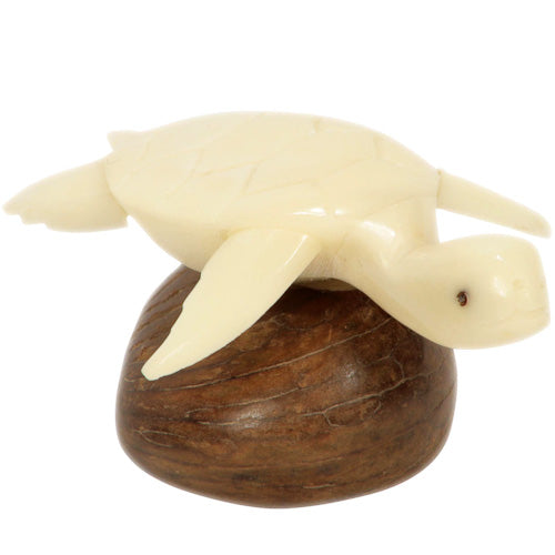 Hand-carved Natural Sea Turtle figurine made from tagua nuts, showcasing intricate details and natural colors.