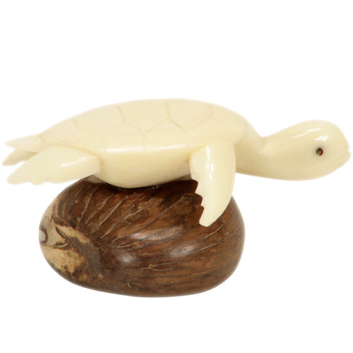 Hand-carved Natural Sea Turtle figurine made from tagua nuts, showcasing intricate details and natural colors.