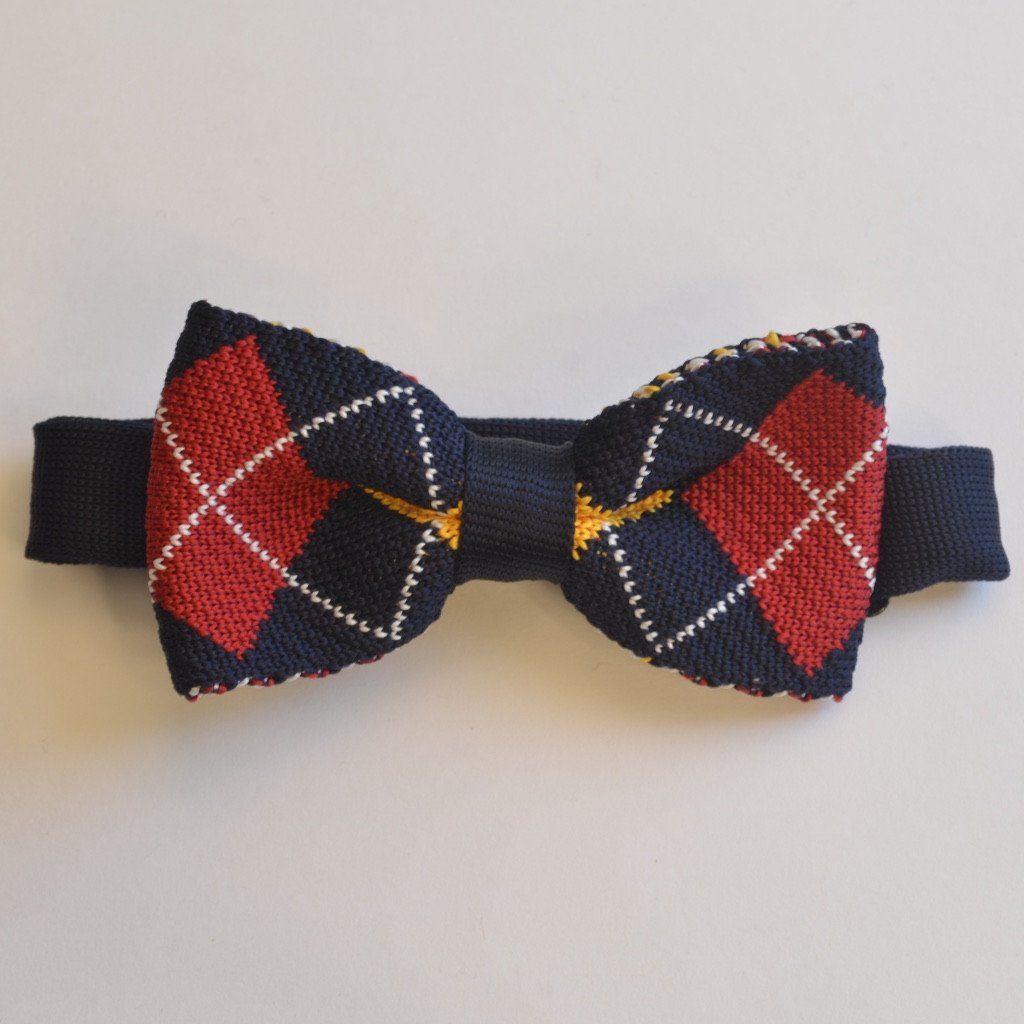 Navy blue and red diamond patterned knitted bow tie, pre-tied and adjustable for a perfect fit.