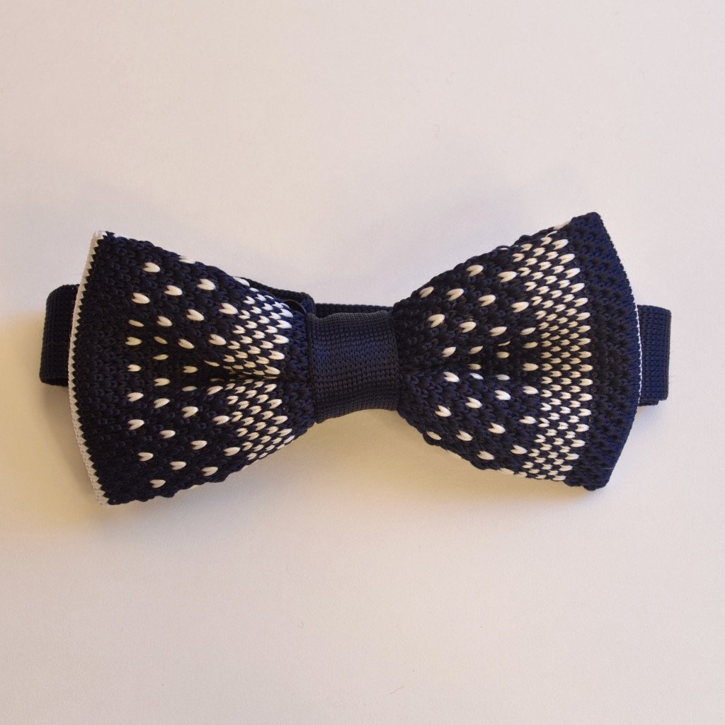 Navy blue and white detailed knitted bow tie, pre-tied and adjustable, made from durable polyester.