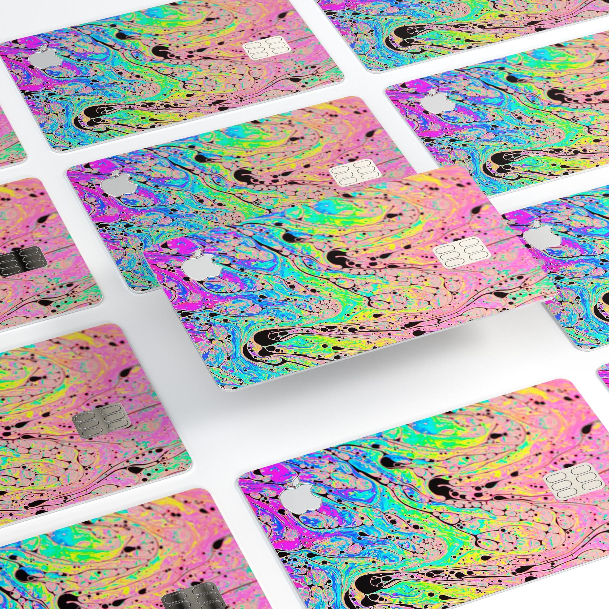 Neon Color Fusion decal with black splatters applied on an Apple Card, showcasing vibrant colors and stylish design.