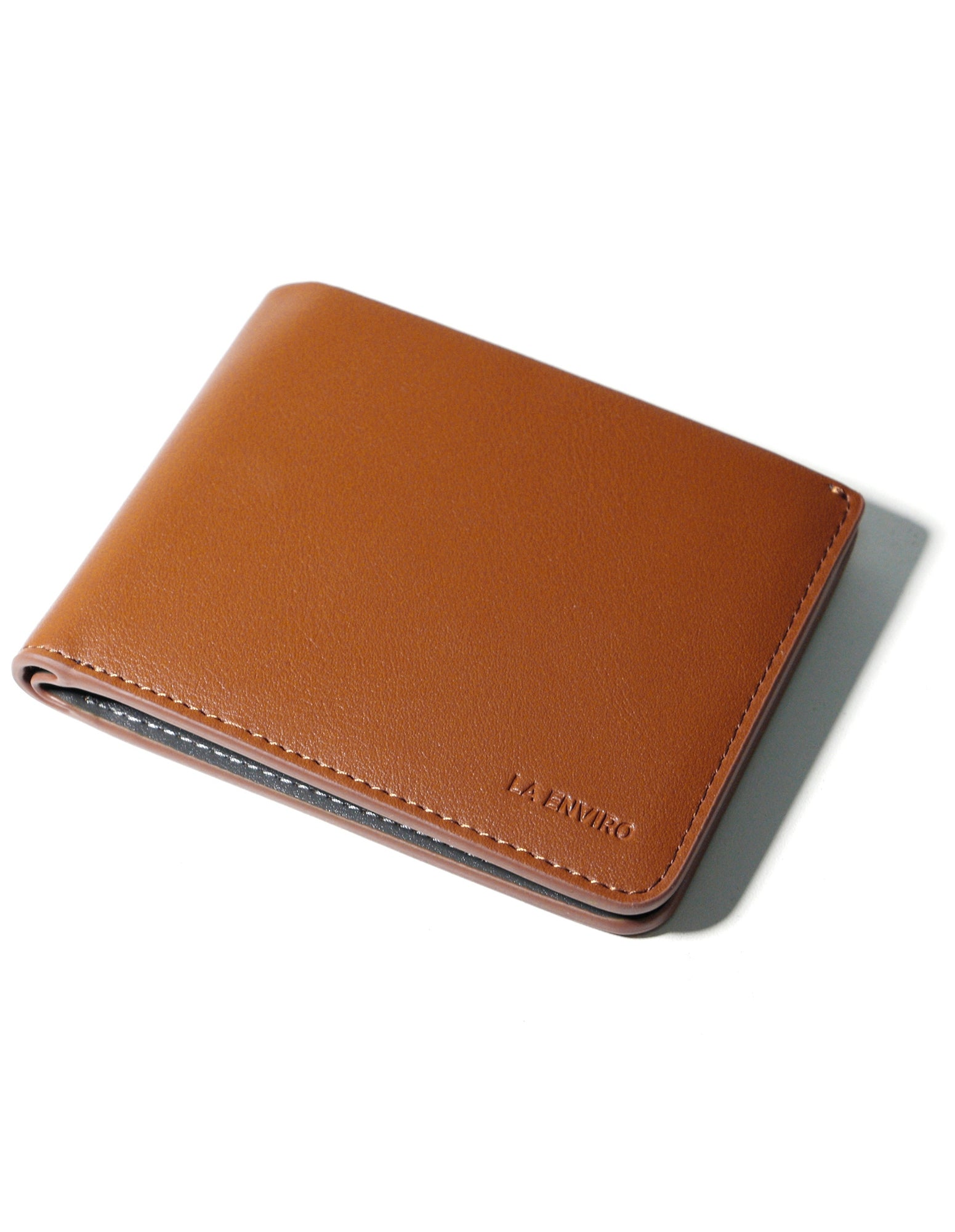 NEWTOWN Wallet in Tan made from premium vegan leather, featuring multiple card slots, a hidden coin pouch, and a sleek minimalist design.