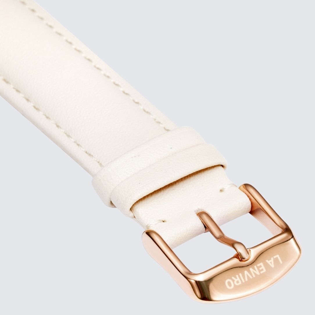 Nude Vegan Leather Watch Strap with stainless steel buckle in rose gold, showcasing its soft texture and quick release pins.