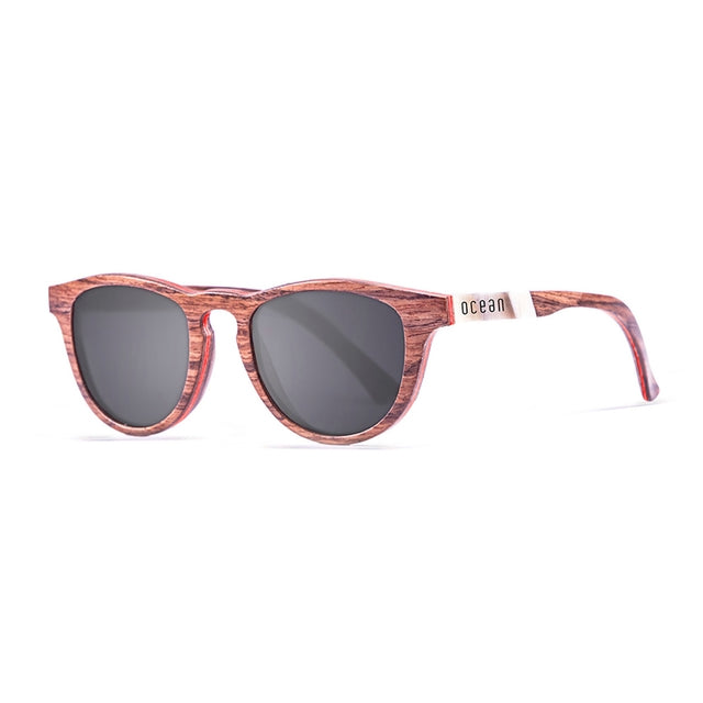 OCEAN GLASSES AZORES 54003.4 featuring round wooden frames in vibrant red color, designed for unisex wear.