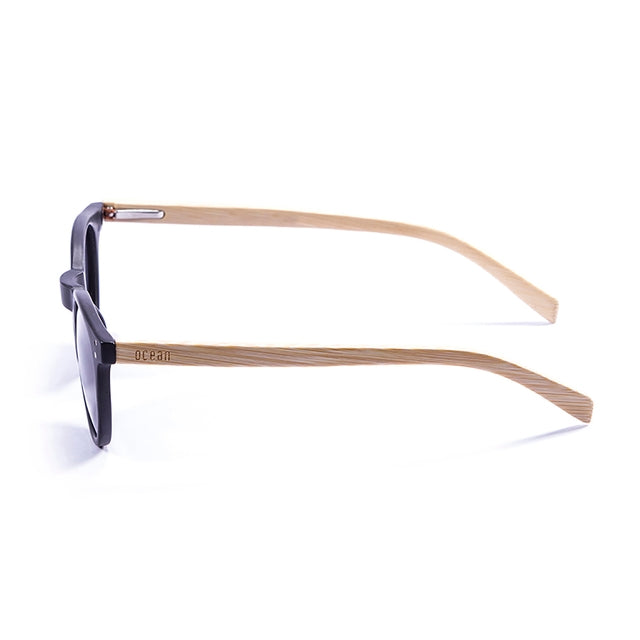 OCEAN GLASSES LIZARD WOOD 55000.1 featuring a round full-rimmed black plastic frame, suitable for unisex wear.