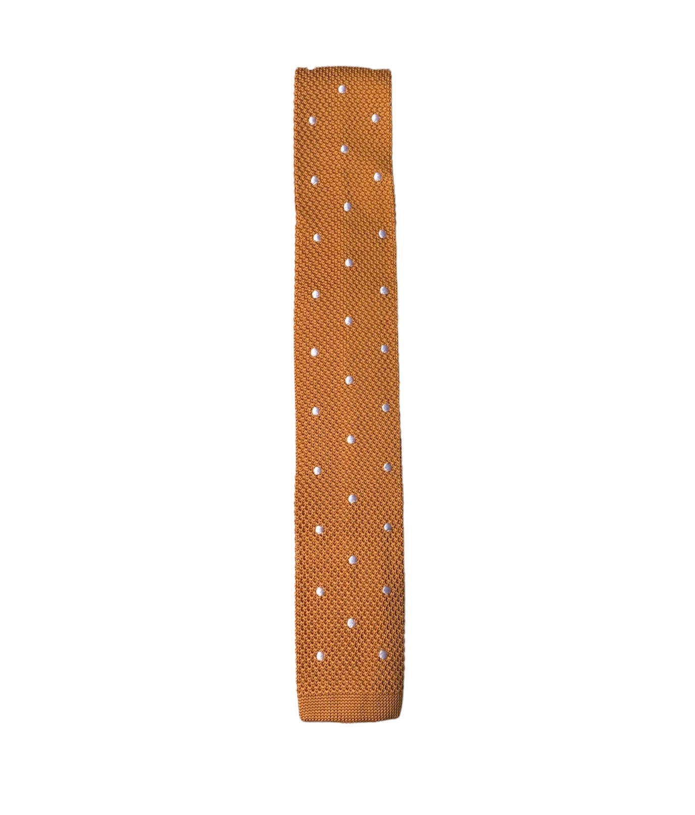 Ochre silk knitted tie with white polka dots, featuring a square end design and a width of 6.5cm.