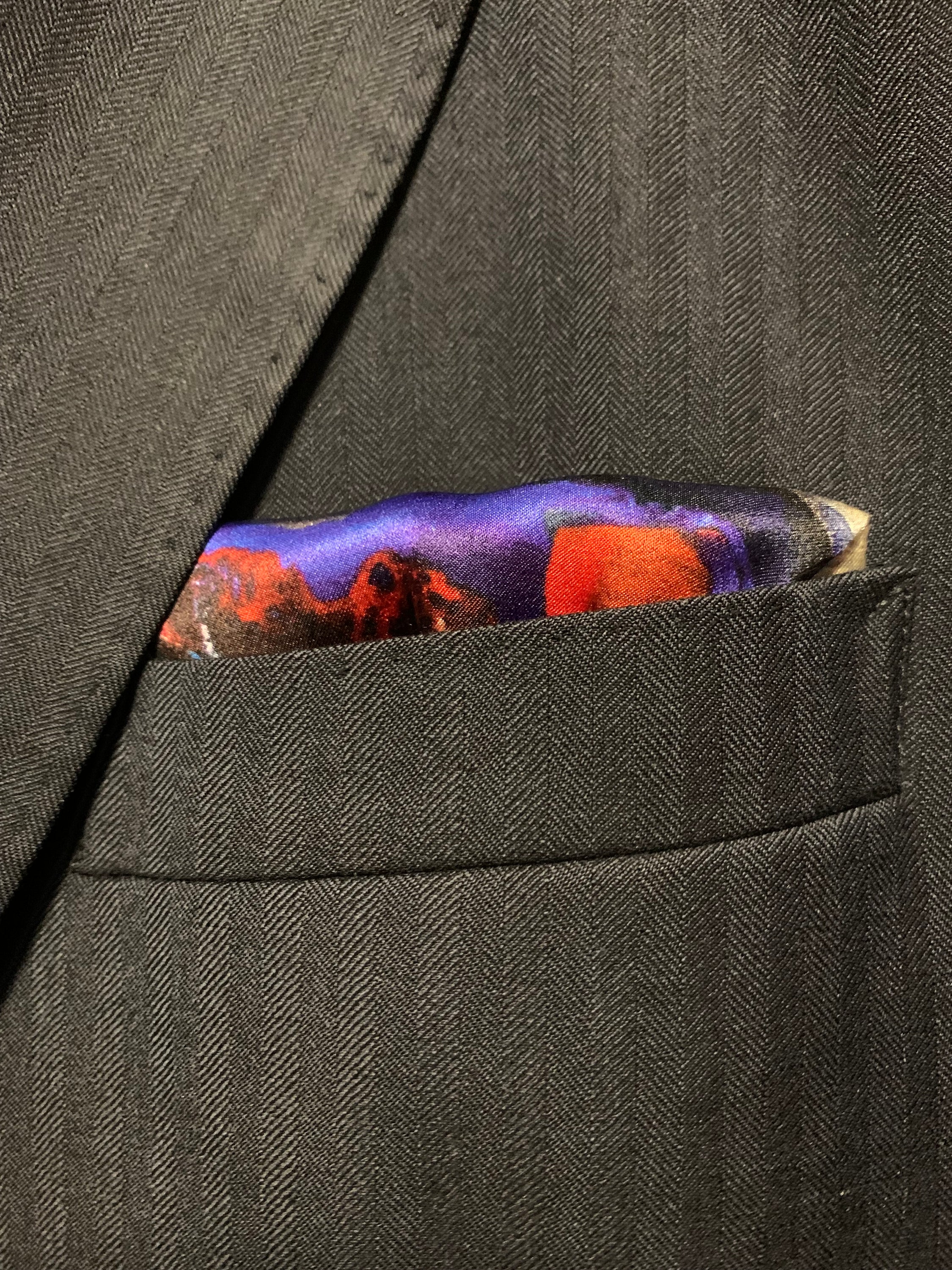 Oh How She Shone Pocket Square featuring vibrant colors and intricate patterns inspired by the northern lights.