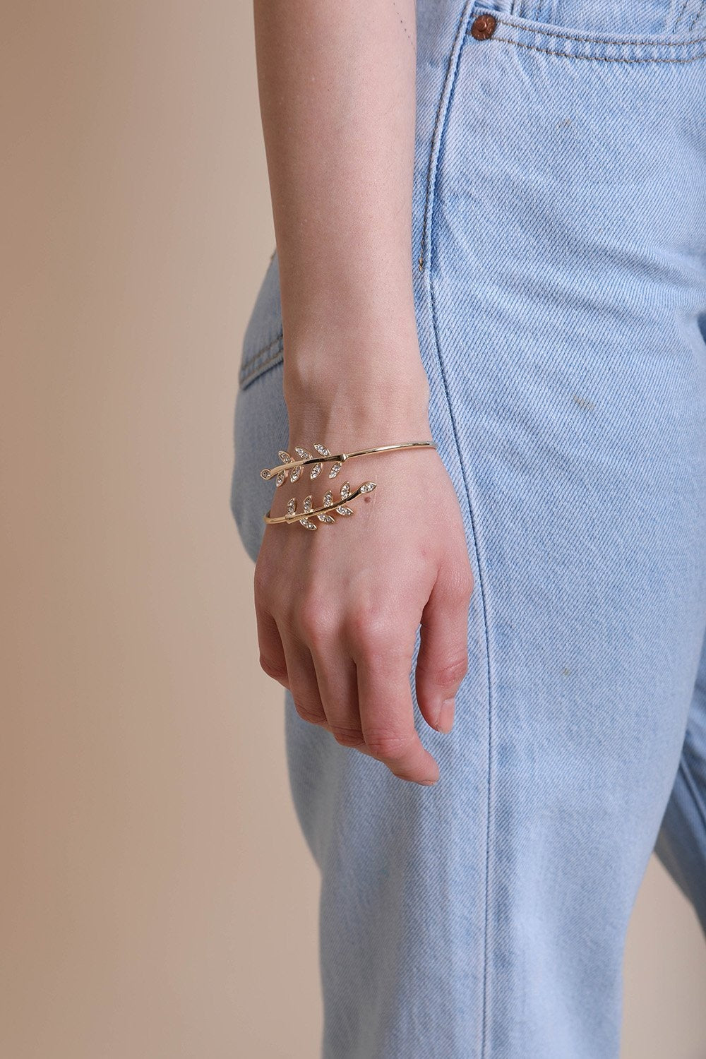 Olive Branch Minimal Bracelet featuring copper leaf embellishments, showcasing a stylish and elegant design.