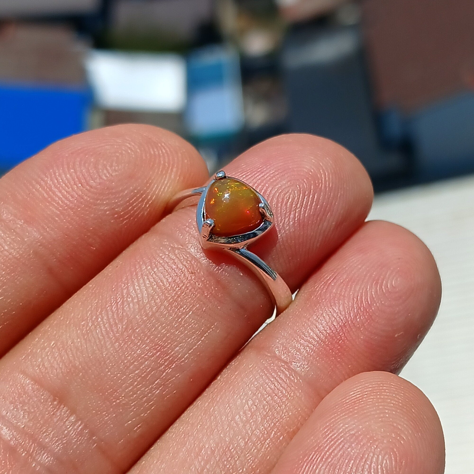 A stunning handcrafted sterling silver Opal Ring featuring a mesmerizing oval-shaped opal with vibrant colors and a mirror polished finish.