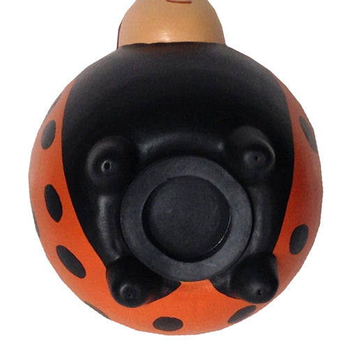 Handmade orange ceramic ladybug bank with removable rubber stopper, showcasing intricate craftsmanship by Peruvian artisans.