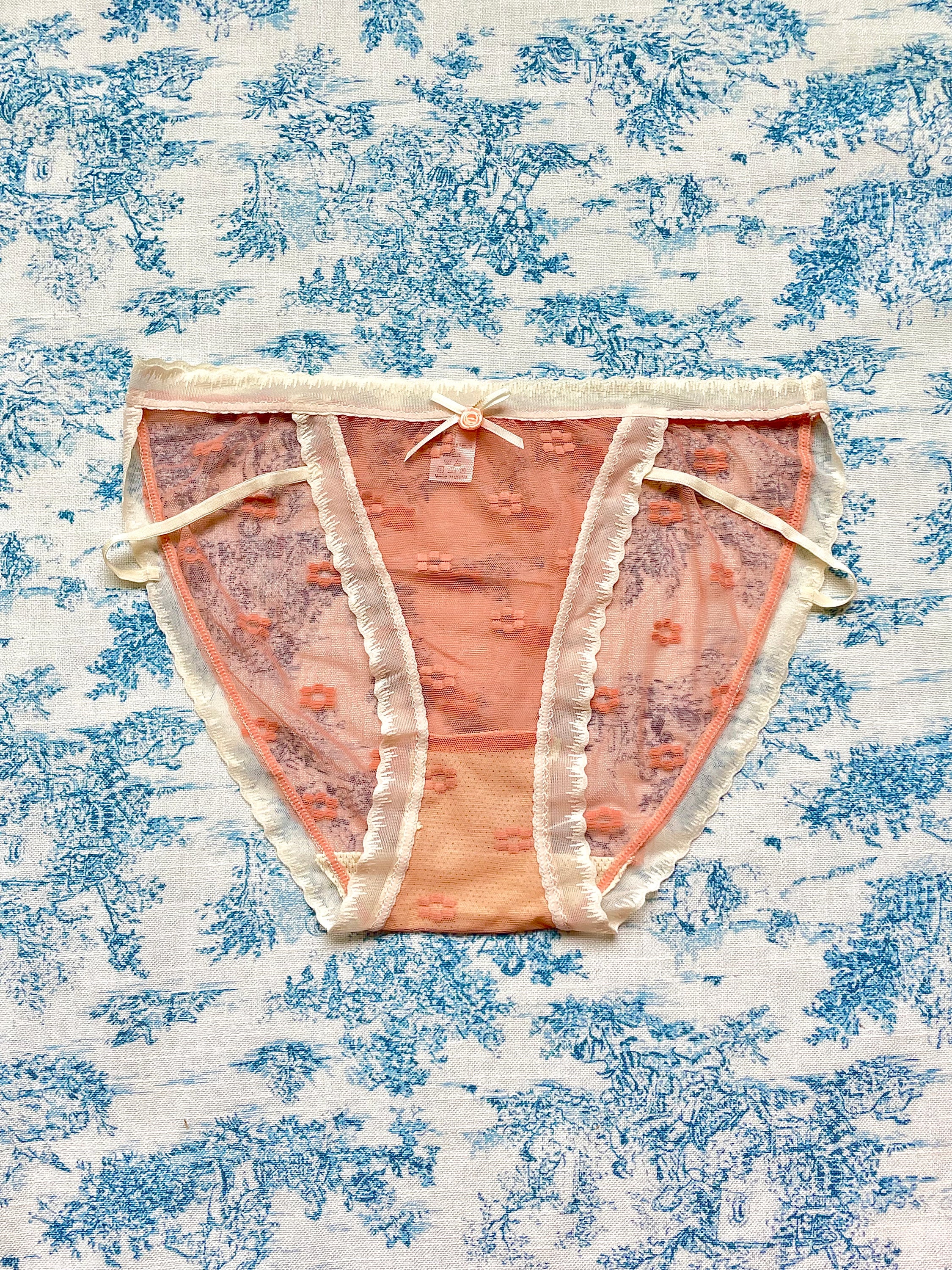 Orange Floral Panty featuring delicate mesh design, vibrant floral print, and ivory lace trim with a charming bow detail.