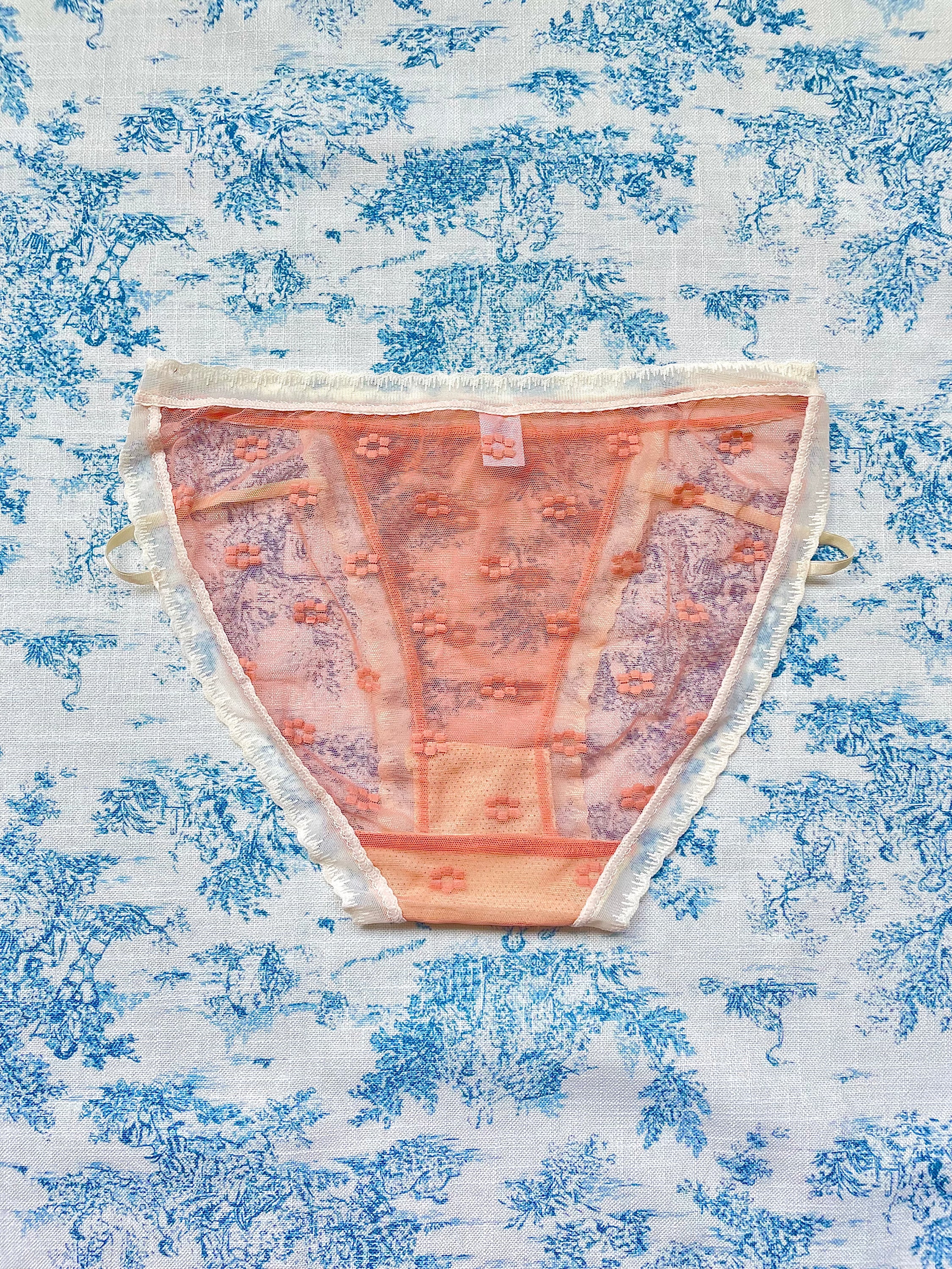 Orange Floral Panty featuring delicate mesh design, vibrant floral print, and ivory lace trim with a charming bow detail.