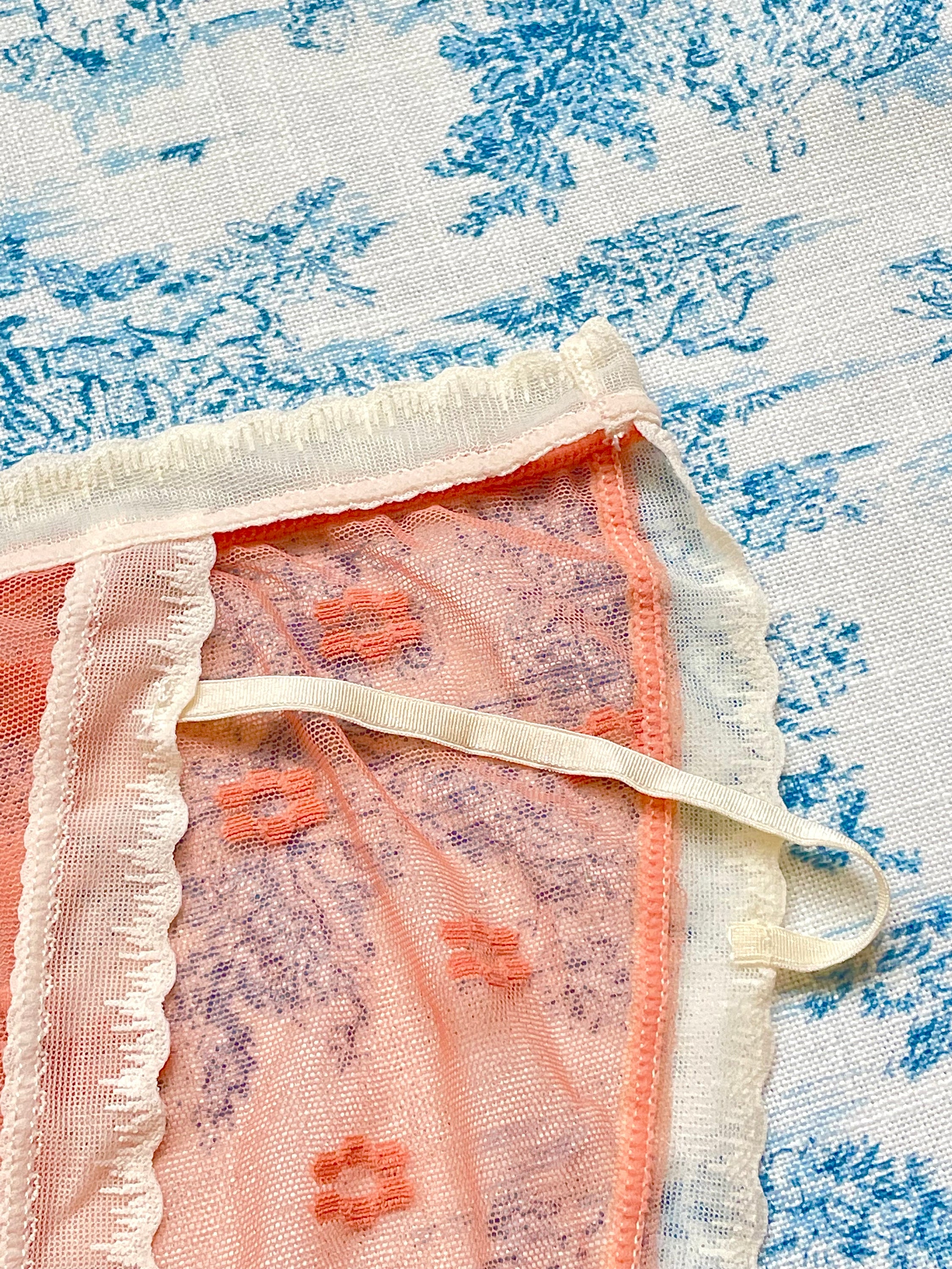 Orange Floral Panty featuring delicate mesh design, vibrant floral print, and ivory lace trim with a charming bow detail.