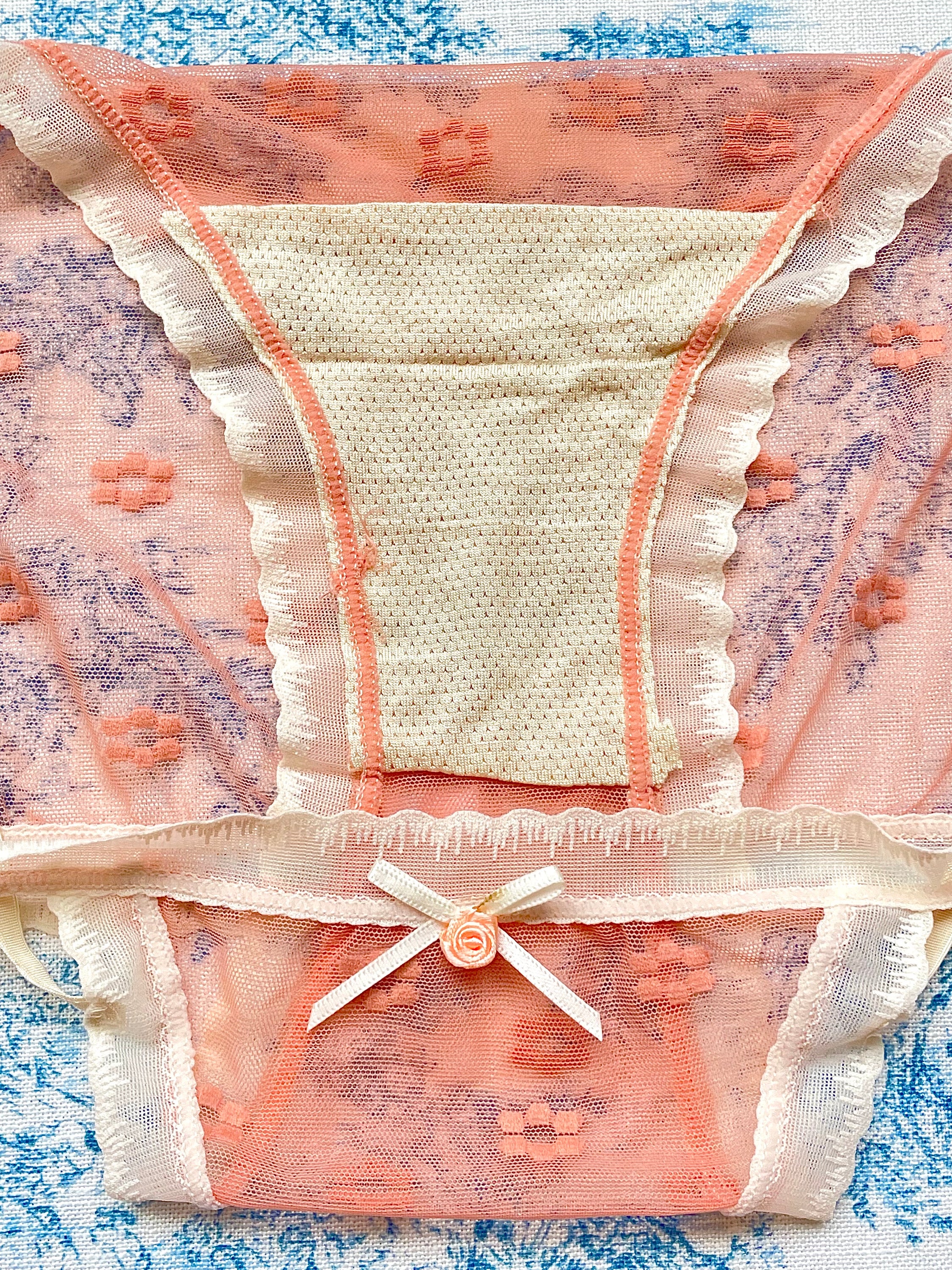 Orange Floral Panty featuring delicate mesh design, vibrant floral print, and ivory lace trim with a charming bow detail.