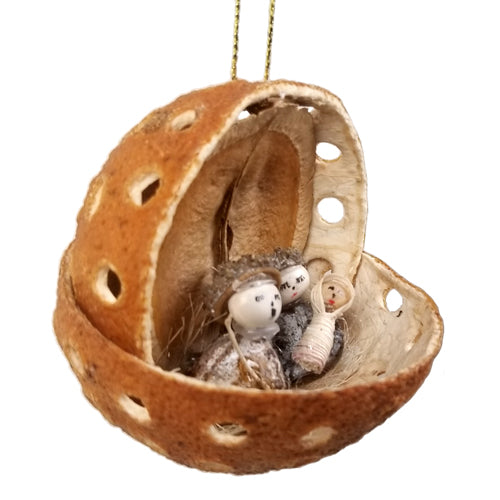 Handcrafted Orange Peel Nativity Ornament featuring Mary, Joseph, and baby Jesus made from natural materials, perfect for Christmas decor.