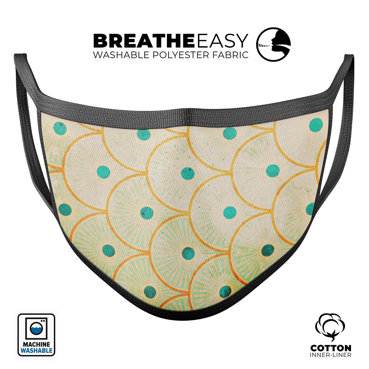 Orange semicircles with teal polka dots on a reusable face mask, showcasing adjustable ear loops and soft cotton interior.